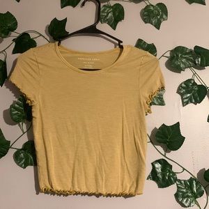 American eagle ruffled shirt! With yellow stripes and and flattering fit :)